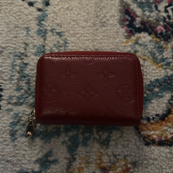 Deep red embossed with imprint detailing accordion zip around wallet - Picture 1 of 4